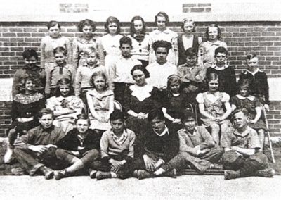 sixth grade with Dawn Worsell, George Isaac, Michael Saleem, Michael Moses. George Isaac third from left in the first row. Michael Saleem Fifth from left in the first row. Dawn Worsell sixth from left in the second row. Michael Moses fifth from left in the third row.